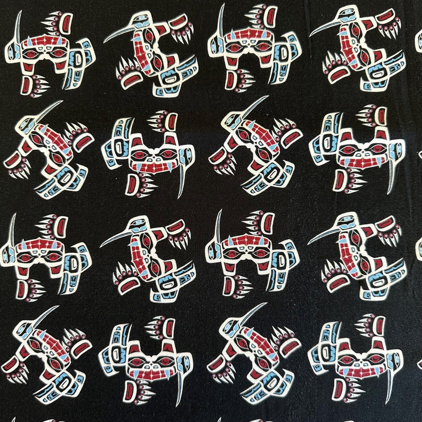 Pattern of bears with red, white, and blue colors on a black background.