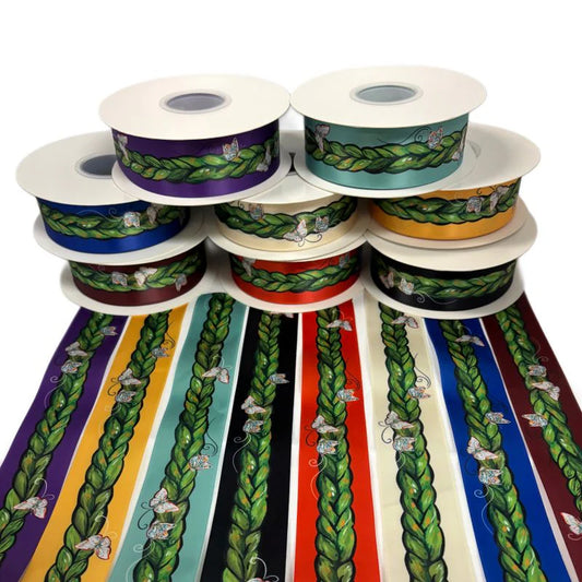 Collection of ribbon spools with colorful patterns on a white background